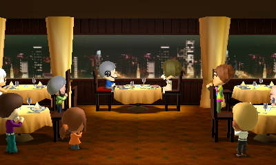 A zoomed out shot of the restaurant, there are multiple dining tables and everyone who was dining are now standing up and clapping for the newly engaged couple.